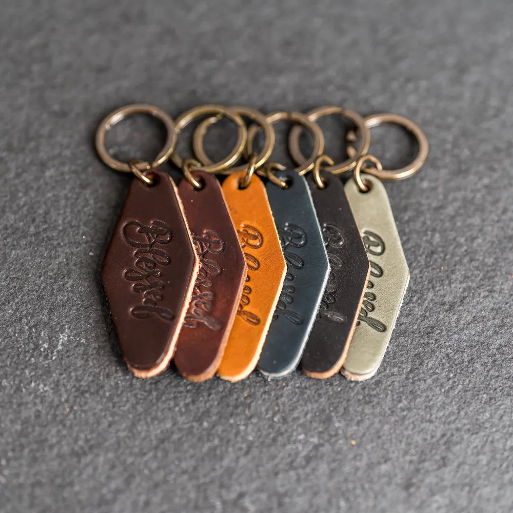 Leather Motel Key Shape Keychain with a Blessed Stamp Design