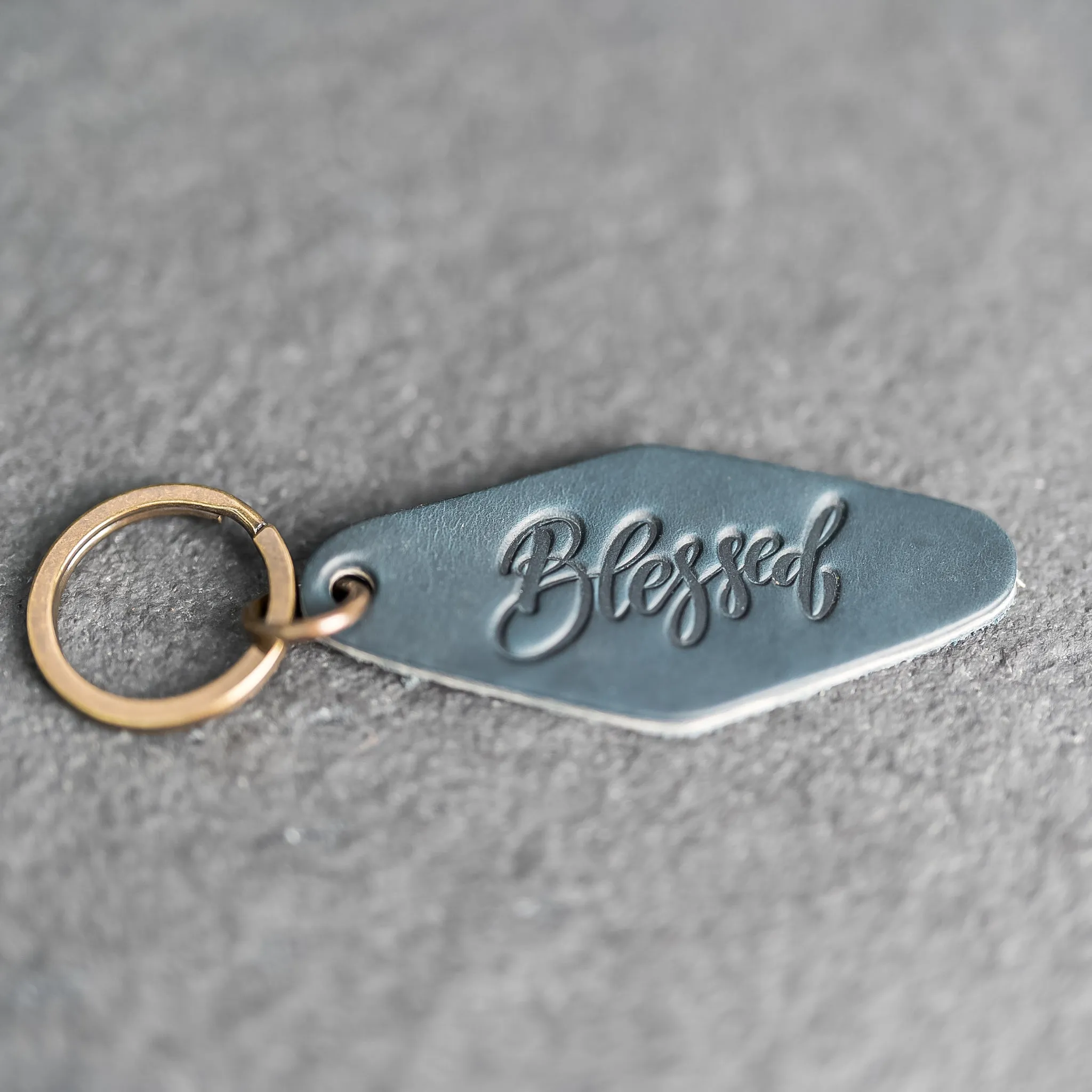 Leather Motel Key Shape Keychain with a Blessed Stamp Design