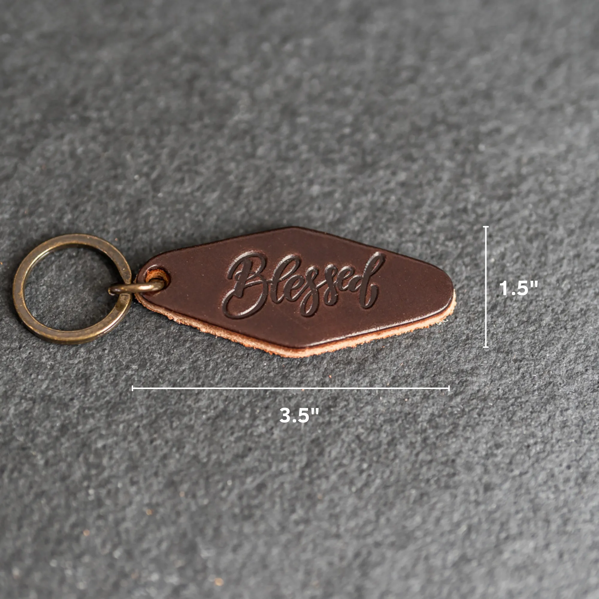 Leather Motel Key Shape Keychain with a Blessed Stamp Design