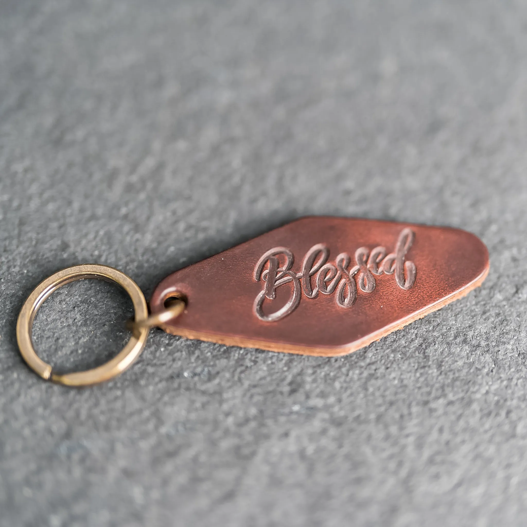 Leather Motel Key Shape Keychain with a Blessed Stamp Design