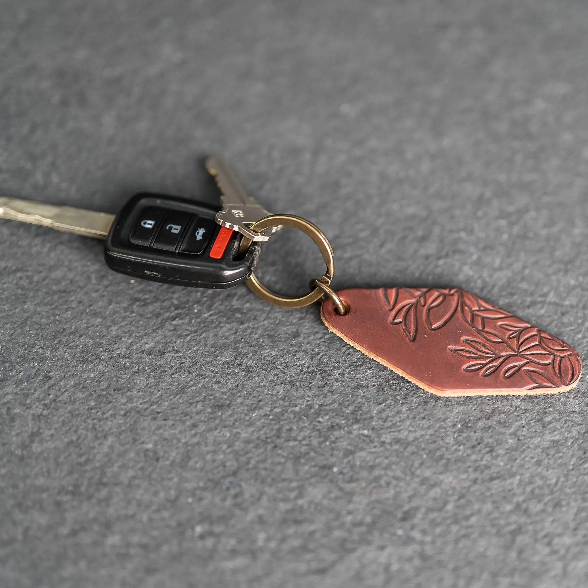 Leather Motel Key Shape Keychain with Floral Stamp Design